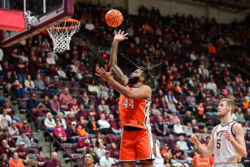 Mar 1, 2025; Blacksburg, Virginia, USA;  Syracuse Orange center Eddie Lampkin Jr. (44) goes up for a shot as Virginia Tech Hokies center Patrick Wessler (5) watches during the first half at Cassell Coliseum. Mandatory Credit: Brian Bishop-Imagn Images