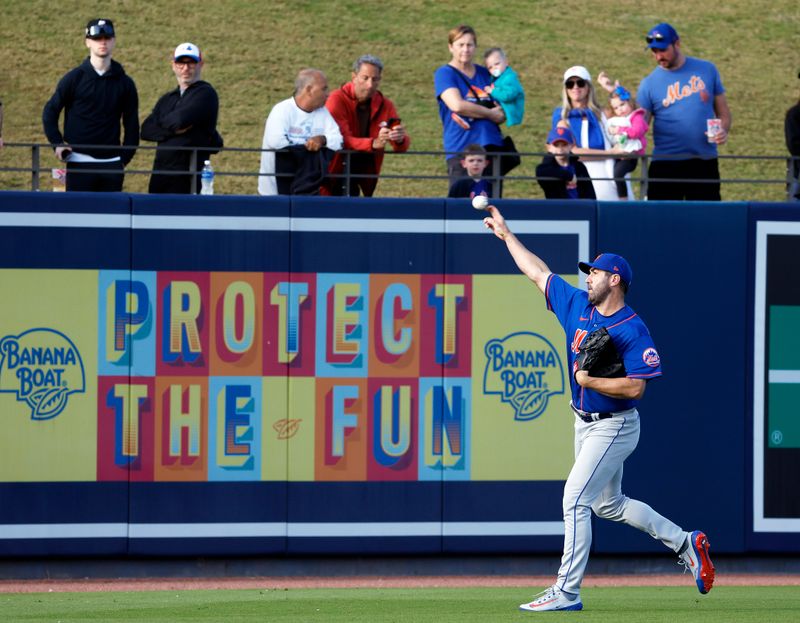 Mar 20, 2023; West Palm Beach, Florida, USA;  Spectors watch New York Mets starting pitcher Justin Verlander (35) warm up against the Washington Nationals before the first inning at The Ballpark of the Palm Beaches. Mandatory Credit: Rhona Wise-USA TODAY Sports