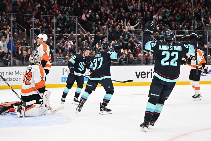 Feb 16, 2023; Seattle, Washington, USA; The Seattle Kraken celebrate after a goal scored by center Yanni Gourde (37) during the first period against the Philadelphia Flyers at Climate Pledge Arena. Mandatory Credit: Steven Bisig-USA TODAY Sports