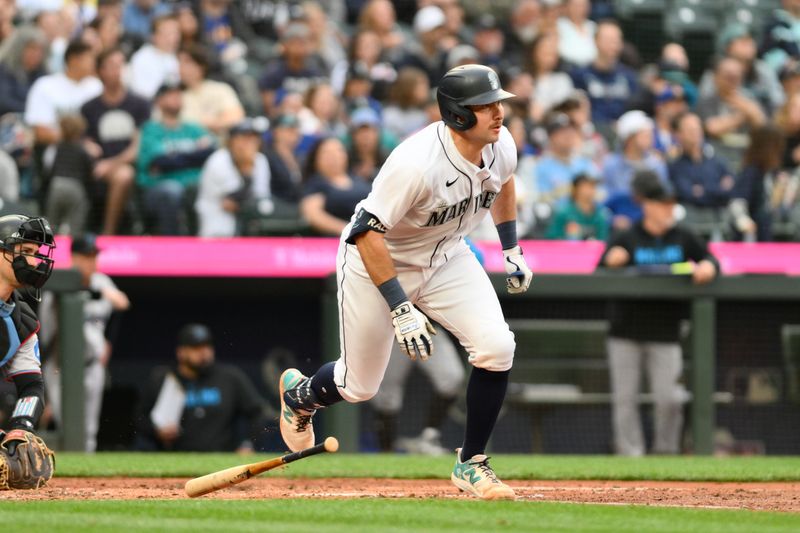 Jun 14, 2023; Seattle, Washington, USA; Seattle Mariners catcher Cal Raleigh (29) runs towards first base after hitting a double against the Miami Marlins during the fifth inning at T-Mobile Park. Mandatory Credit: Steven Bisig-USA TODAY Sports