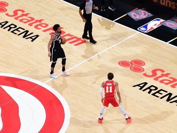 ATLANTA, GA - DECEMBER 6: Spencer Dinwiddie #26 of the Brooklyn Nets handles the ball against defender Trae Young #11 of the Atlanta Hawks during the game on December 6, 2023 at State Farm Arena in Atlanta, Georgia.  NOTE TO USER: User expressly acknowledges and agrees that, by downloading and/or using this Photograph, user is consenting to the terms and conditions of the Getty Images License Agreement. Mandatory Copyright Notice: Copyright 2023 NBAE (Photo by Scott Cunningham/NBAE via Getty Images)