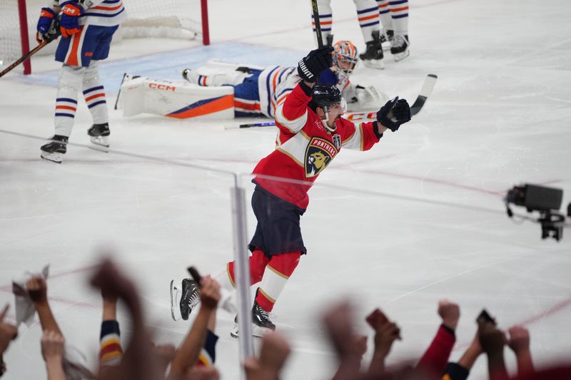 Jun 9, 2025; Sunrise, Florida, USA; Florida Panthers forward Brad Marchand (63) celebrates scoring against Edmonton Oilers goaltender Stuart Skinner (74) during the first period in game three of the 2025 Stanley Cup Final at Amerant Bank Arena. Mandatory Credit: Jim Rassol-Imagn Images