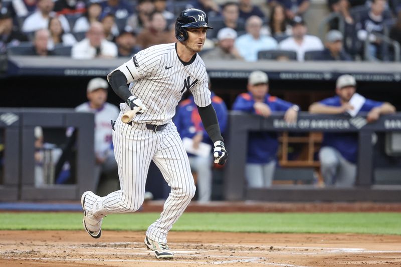 May 18, 2025; Bronx, New York, USA;  New York Yankees left fielder Cody Bellinger (35) hits a two-run double in the first inning against the New York Mets at Yankee Stadium. Mandatory Credit: Wendell Cruz-Imagn Images