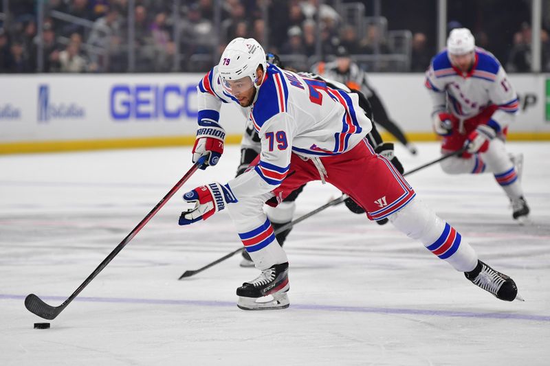 Jan 20, 2024; Los Angeles, California, USA; New York Rangers defenseman K'Andre Miller (79) moves in for a shot on goal against the Los Angeles Kings durng the first period at Crypto.com Arena. Mandatory Credit: Gary A. Vasquez-USA TODAY Sports