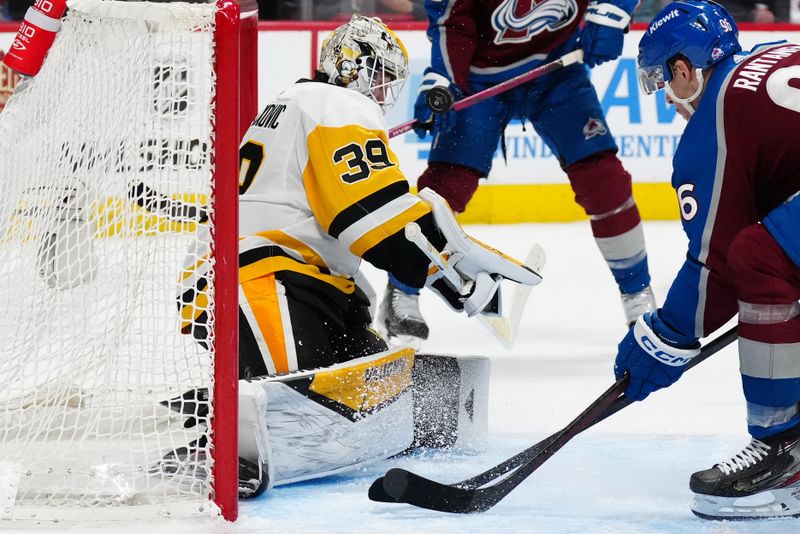 Mar 24, 2024; Denver, Colorado, USA; Colorado Avalanche right wing Mikko Rantanen (96) looks for the puck to rebound off the mask of Pittsburgh Penguins goaltender Alex Nedeljkovic (39) in second period at Ball Arena. Mandatory Credit: Ron Chenoy-USA TODAY Sports