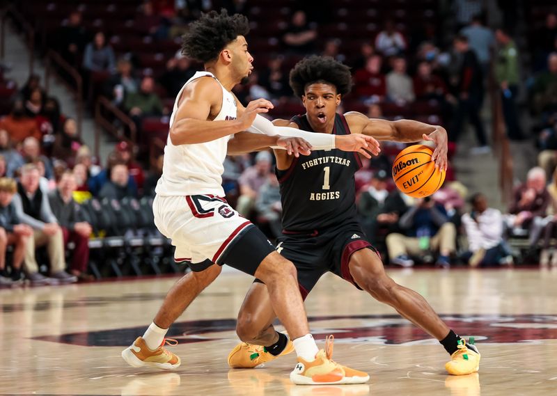 Jan 14, 2023; Columbia, South Carolina, USA; Texas A&M Aggies guard Khalen Robinson (1) drives around South Carolina Gamecocks guard Jacobi Wright (1) in the second half at Colonial Life Arena. Mandatory Credit: Jeff Blake-USA TODAY Sports