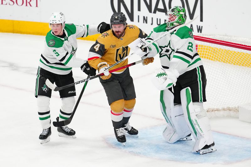 Jan 29, 2026; Las Vegas, Nevada, USA; Vegas Golden Knights defenseman Rasmus Andersson (4) is checked by Dallas Stars defenseman Nils Lundkvist (5) and goaltender Jake Oettinger (29) during the third period at T-Mobile Arena. Mandatory Credit: Stephen R. Sylvanie-Imagn Images