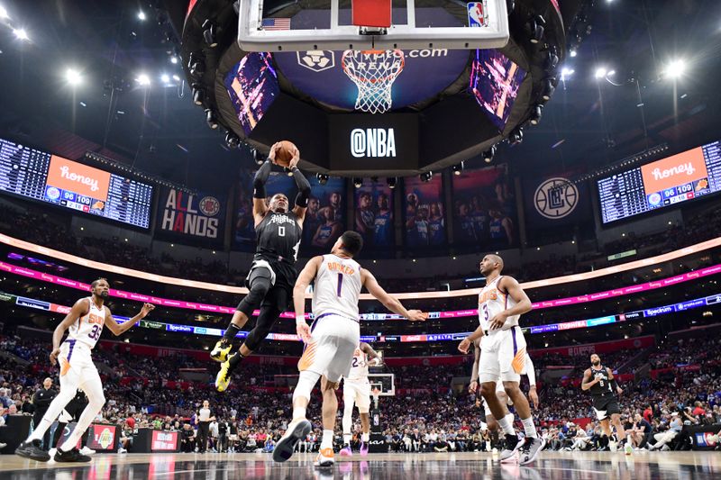 LOS ANGELES, CA - APRIL 22:  Russell Westbrook  #0 of the LA Clippers goes to the basket against the Phoenix Suns during Round 1 Game 4 of the 2023 NBA Playoffs on April 22, 2023 at Crypto.Com Arena in Los Angeles, California. NOTE TO USER: User expressly acknowledges and agrees that, by downloading and/or using this Photograph, user is consenting to the terms and conditions of the Getty Images License Agreement. Mandatory Copyright Notice: Copyright 2023 NBAE (Photo by Adam Pantozzi/NBAE via Getty Images)