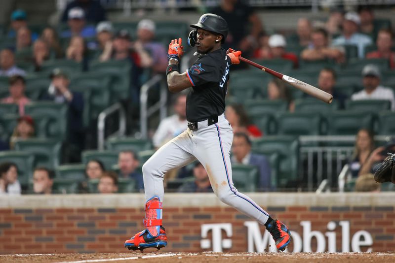 Apr 24, 2024; Atlanta, Georgia, USA; Miami Marlins center fielder Jazz Chisholm Jr. (2) hits a single against the Atlanta Braves in the ninth inning at Truist Park. Mandatory Credit: Brett Davis-USA TODAY Sports