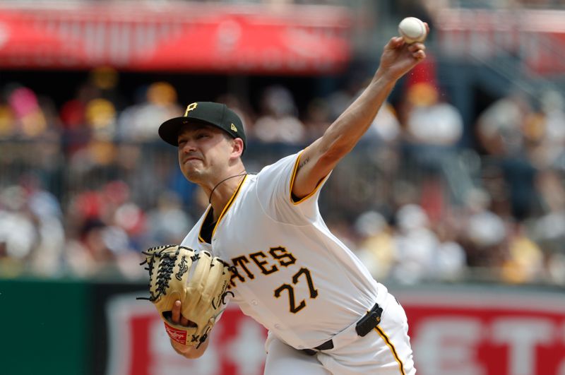 Jul 21, 2024; Pittsburgh, Pennsylvania, USA;  Pittsburgh Pirates starting pitcher Marco Gonzales (27) delivers a pitch against the Philadelphia Phillies during the first inning at PNC Park. Mandatory Credit: Charles LeClaire-USA TODAY Sports