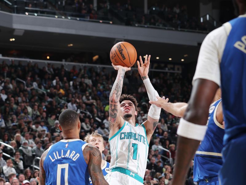 MILWAUKEE, WI - NOVEMBER 23: LaMelo Ball #1 of the Charlotte Hornets drives to the basket during the game against the Milwaukee Bucks on November 23, 2024 at the Fiserv Forum Center in Milwaukee, Wisconsin. NOTE TO USER: User expressly acknowledges and agrees that, by downloading and or using this Photograph, user is consenting to the terms and conditions of the Getty Images License Agreement. Mandatory Copyright Notice: Copyright 2024 NBAE (Photo by Gary Dineen/NBAE via Getty Images).