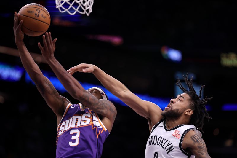 PHOENIX, ARIZONA - NOVEMBER 27: Bradley Beal #3 of the Phoenix Suns attempts a layup against Trendon Watford #9 of the Brooklyn Nets during the second half at Footprint Center on November 27, 2024 in Phoenix, Arizona. NOTE TO USER: User expressly acknowledges and agrees that, by downloading and or using this photograph, User is consenting to the terms and conditions of the Getty Images License Agreement.  (Photo by Chris Coduto/Getty Images)