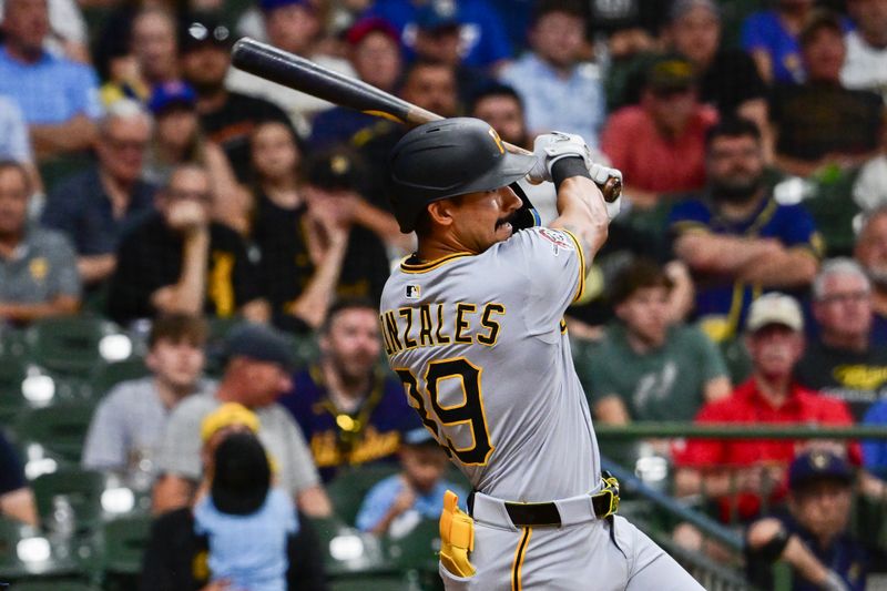 Jun 24, 2025; Milwaukee, Wisconsin, USA;  Pittsburgh Pirates second baseman Nick Gonzales hits a three-run home run in the sixth inning against the Milwaukee Brewers at American Family Field. Mandatory Credit: Benny Sieu-Imagn Images