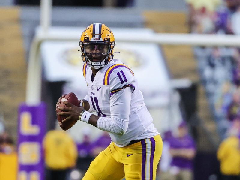 Oct 24, 2020; Baton Rouge, Louisiana, USA; LSU Tigers quarterback TJ Finley (11) looks to pass against the South Carolina Gamecocks during the first half at Tiger Stadium. Mandatory Credit: Derick E. Hingle-USA TODAY Sports