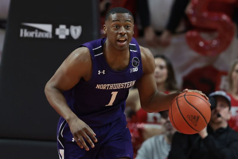 Mar 5, 2023; Piscataway, New Jersey, USA; Northwestern Wildcats guard Chase Audige (1) brings the ball up court during the first half against the Rutgers Scarlet Knights at Jersey Mike's Arena. Mandatory Credit: Vincent Carchietta-USA TODAY Sports