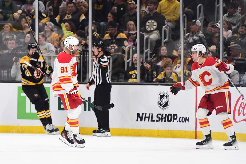 Nov 7, 2024; Boston, Massachusetts, USA;  Calgary Flames center Nazem Kadri (91) reacts after scoring a goal during the third period against the Boston Bruins at TD Garden. Mandatory Credit: Bob DeChiara-Imagn Images