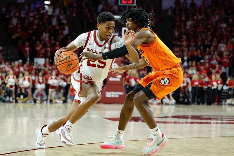 Feb 1, 2023; Norman, Oklahoma, USA; Oklahoma Sooners guard Grant Sherfield (25) drives to the basket as Oklahoma State Cowboys guard Caleb Asberry (5) defends during the second half at Lloyd Noble Center. Mandatory Credit: Alonzo Adams-USA TODAY Sports