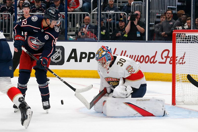 Oct 15, 2024; Columbus, Ohio, USA; Florida Panthers goalie Spencer Knight (30) makes a save on the shot from Columbus Blue Jackets left wing Mikael Pyyhtia (82) during the second period at Nationwide Arena. Mandatory Credit: Russell LaBounty-Imagn Images