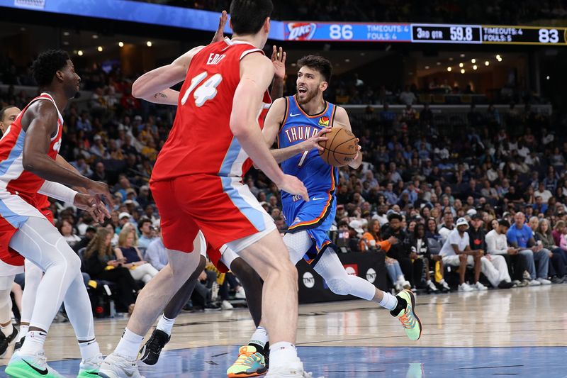 MEMPHIS, TENNESSEE - APRIL 26: Chet Holmgren #7 of the Oklahoma City Thunder goes to the basket against Zach Edey #14 of the Memphis Grizzlies during the second half of Game Four of the Western Conference First Round NBA Playoffs at FedExForum on April 26, 2025 in Memphis, Tennessee. NOTE TO USER: User expressly acknowledges and agrees that, by downloading and or using this photograph, User is consenting to the terms and conditions of the Getty Images License Agreement. (Photo by Justin Ford/Getty Images)