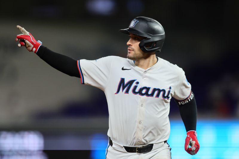 Sep 19, 2024; Miami, Florida, USA; Miami Marlins catcher Nick Fortes (4) circles the bases after hitting a home run against the Los Angeles Dodgers during the ninth inning at loanDepot Park. Mandatory Credit: Sam Navarro-Imagn Images