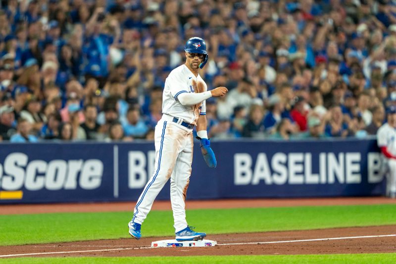 Jul 15, 2023; Toronto, Ontario, CAN; Toronto Blue Jays second baseman Whit Merrifield (15) celebrates after being called safe at third against the Arizona Diamondbacks during the second inning at Rogers Centre. Mandatory Credit: Kevin Sousa-USA TODAY Sports