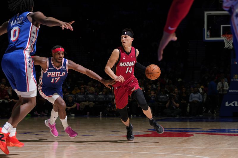 PHILADELPHIA, PA - FEBRUARY 14: Tyler Herro #14 of the Miami Heat dribbles the ball during the game against the Philadelphia 76ers on February 14, 2024 at the Wells Fargo Center in Philadelphia, Pennsylvania NOTE TO USER: User expressly acknowledges and agrees that, by downloading and/or using this Photograph, user is consenting to the terms and conditions of the Getty Images License Agreement. Mandatory Copyright Notice: Copyright 2024 NBAE (Photo by Jesse D. Garrabrant/NBAE via Getty Images)