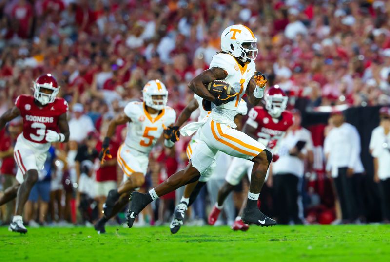 Sep 21, 2024; Norman, Oklahoma, USA;  Tennessee Volunteers wide receiver Dont'e Thornton Jr. (1) runs for a touchdown during the first quarter against the Oklahoma Sooners at Gaylord Family-Oklahoma Memorial Stadium. Mandatory Credit: Kevin Jairaj-Imagn Images