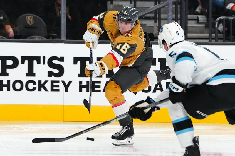 Sep 27, 2024; Las Vegas, Nevada, USA; Vegas Golden Knights left wing Pavel Dorofeyev (16) shoots over the stick of Utah Hockey Club defenseman Robbie Russo (5) during the second period at T-Mobile Arena. Mandatory Credit: Stephen R. Sylvanie-Imagn Images