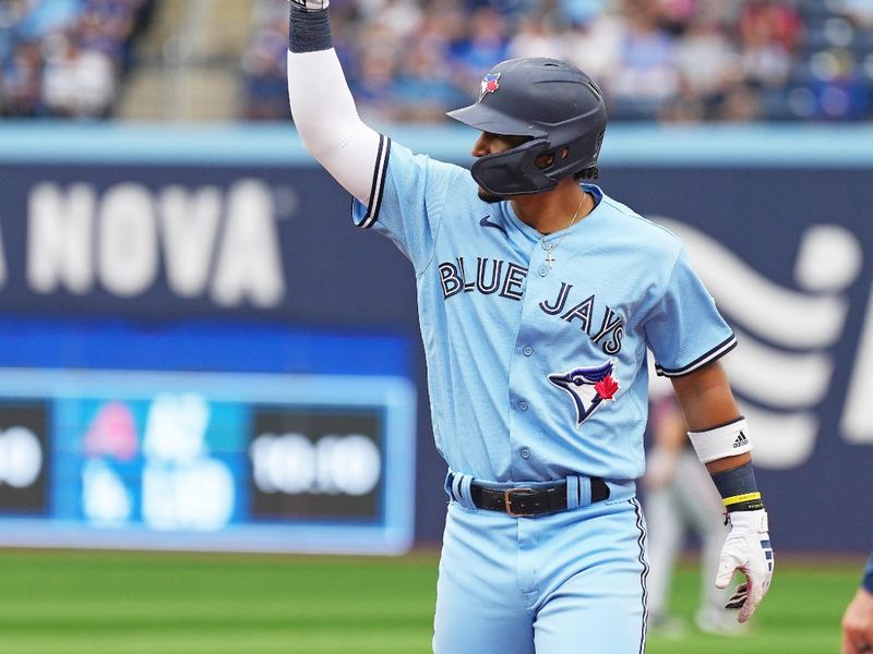 Aug 30, 2023; Toronto, Ontario, CAN; Toronto Blue Jays third baseman Santiago Espinal (5) celebrates hitting an RBI single against the Washington Nationals during the sixth inning at Rogers Centre. Mandatory Credit: Nick Turchiaro-USA TODAY Sports