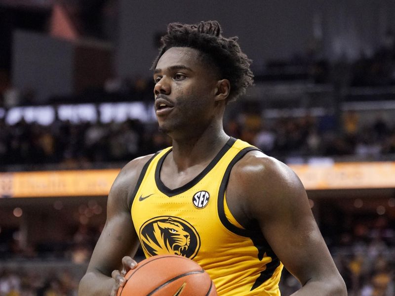 Jan 7, 2023; Columbia, Missouri, USA; Missouri Tigers guard Kobe Brown (24) looks to pass against the Vanderbilt Commodores during the second half at Mizzou Arena. Mandatory Credit: Denny Medley-USA TODAY Sports