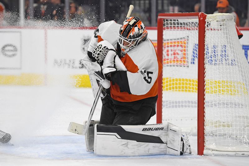 Nov 18, 2024; Philadelphia, Pennsylvania, USA; Philadelphia Flyers goaltender Aleksei Kolosov (35) makes a save against the Colorado Avalanche during the second period at Wells Fargo Center. Mandatory Credit: Eric Hartline-Imagn Images