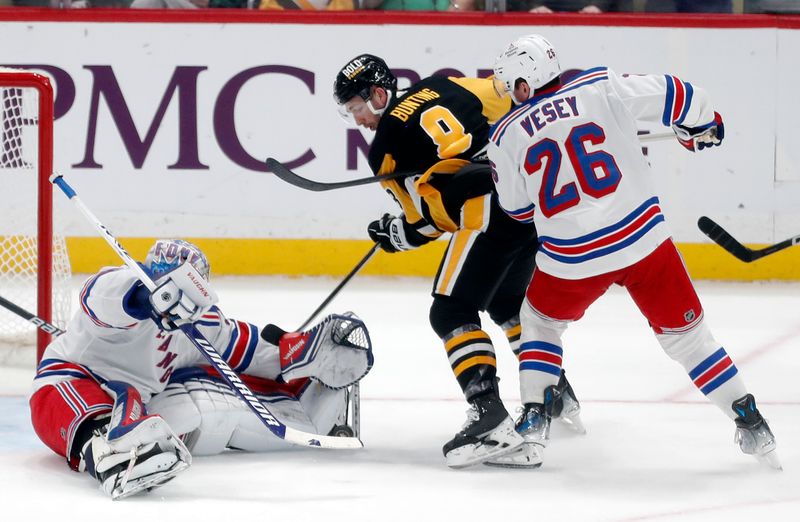 Mar 16, 2024; Pittsburgh, Pennsylvania, USA;  New York Rangers goaltender Jonathan Quick (32) makes a save against Pittsburgh Penguins left wing Michael Bunting (8) as Rangers left wing Jimmy Vesey (26) defends during the third period at PPG Paints Arena. New York won 7-4. Mandatory Credit: Charles LeClaire-USA TODAY Sports