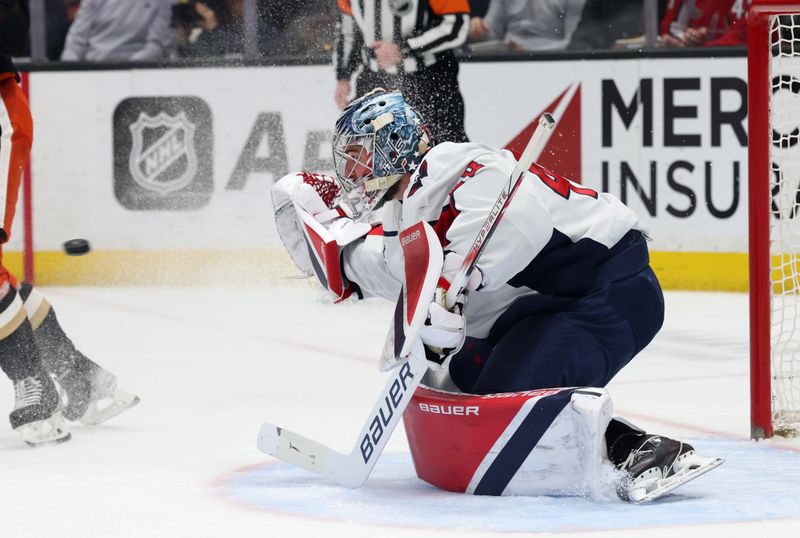 Mar 11, 2025; Anaheim, California, USA; Washington Capitals goaltender Logan Thompson (48) makes a save during the second period against the Anaheim Ducks at Honda Center. Mandatory Credit: Jason Parkhurst-Imagn Images