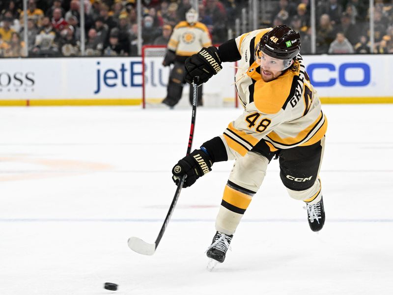 Jan 20, 2024; Boston, Massachusetts, USA; Boston Bruins defenseman Matt Grzelcyk (48) takes a shot for an assist on a goal against the Montreal Canadiens during the first period at the TD Garden. Mandatory Credit: Brian Fluharty-USA TODAY Sports