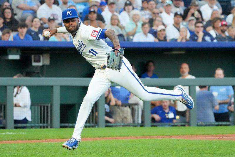 Jun 10, 2024; Kansas City, Missouri, USA; Kansas City Royals third baseman Maikel Garcia (11) fields a ground ball and throws to first for the out in the fourth inning at Kauffman Stadium. Mandatory Credit: Denny Medley-USA TODAY Sports