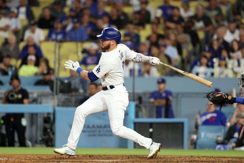 Sep 11, 2024; Los Angeles, California, USA;  Los Angeles Dodgers second baseman Gavin Lux (9) hits an RBI single during the seventh inning against the Chicago Cubs at Dodger Stadium. Mandatory Credit: Kiyoshi Mio-Imagn Images