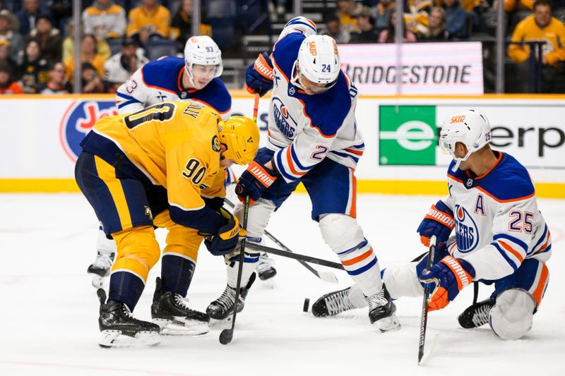 Oct 31, 2024; Nashville, Tennessee, USA;  Edmonton Oilers defenseman Darnell Nurse (25) and defenseman Evan Bouchard (2) block the shot of Nashville Predators center Ryan O'Reilly (90) during the third period at Bridgestone Arena. Mandatory Credit: Steve Roberts-Imagn Images