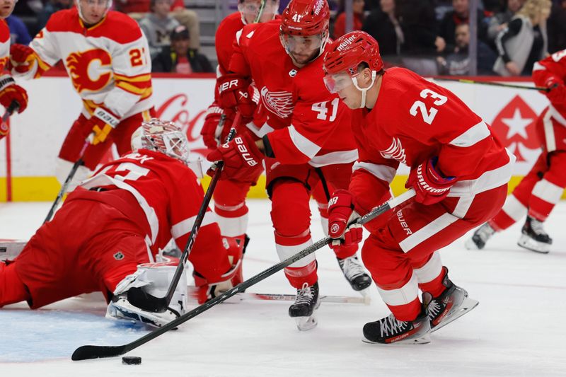 Oct 22, 2023; Detroit, Michigan, USA;  Detroit Red Wings left wing Lucas Raymond (23) skates with the puck in the first period against the Calgary Flames at Little Caesars Arena. Mandatory Credit: Rick Osentoski-USA TODAY Sports