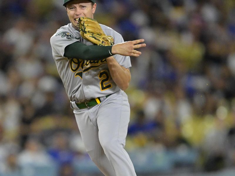 Aug 2, 2023; Los Angeles, California, USA;  Oakland Athletics shortstop Nick Allen (2) throws out Los Angeles Dodgers shortstop Amed Rosario (31) at first base in the third inning at Dodger Stadium. Mandatory Credit: Jayne Kamin-Oncea-USA TODAY Sports