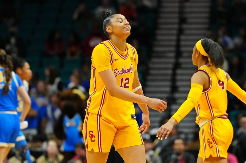 Mar 8, 2024; Las Vegas, NV, USA; USC Trojans guard JuJu Watkins (12) reacts after making a play against the UCLA Bruins during the second quarter at MGM Grand Garden Arena. Mandatory Credit: Stephen R. Sylvanie-USA TODAY Sports