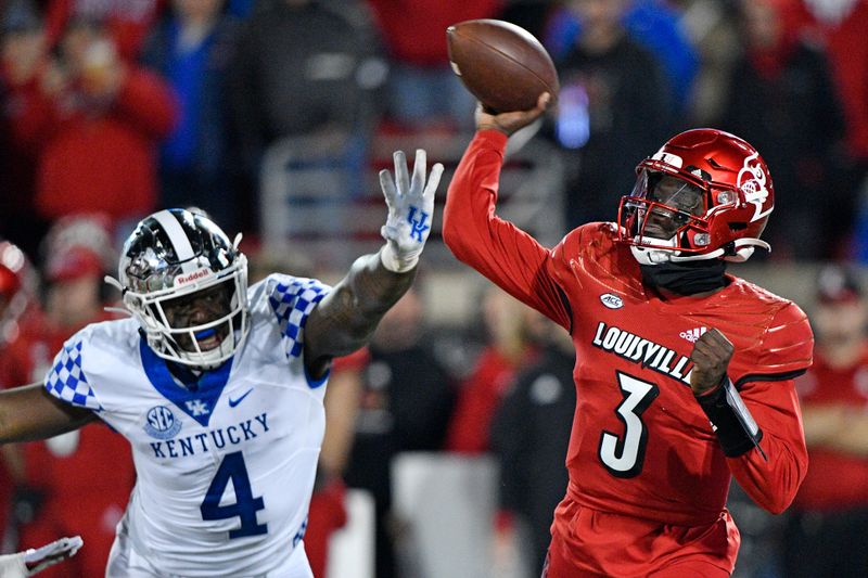 Nov 27, 2021; Louisville, Kentucky, USA;  Louisville Cardinals quarterback Malik Cunningham (3) throws a pass against Kentucky Wildcats defensive end Josh Paschal (4) during the second quarter at Cardinal Stadium. Mandatory Credit: Jamie Rhodes-USA TODAY Sports