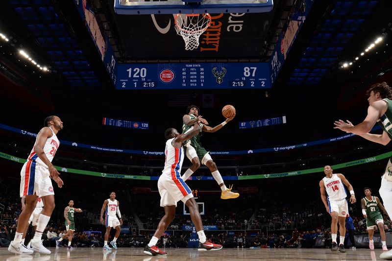 DETROIT, MI - OCTOBER 6: AJ Johnson #77 of the Milwaukee Bucks drives to the basket during the game against the Detroit Pistons during a NBA preseason game on October 6, 2024 at Little Caesars Arena in Detroit, Michigan. NOTE TO USER: User expressly acknowledges and agrees that, by downloading and/or using this photograph, User is consenting to the terms and conditions of the Getty Images License Agreement. Mandatory Copyright Notice: Copyright 2024 NBAE (Photo by Chris Schwegler/NBAE via Getty Images)