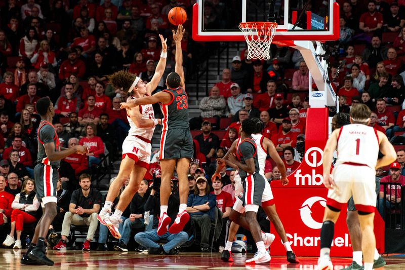 Jan 23, 2024; Lincoln, Nebraska, USA; Nebraska Cornhuskers forward Josiah Allick (53) shoots the ball against Ohio State Buckeyes forward Zed Key (23) during the second half at Pinnacle Bank Arena. Mandatory Credit: Dylan Widger-USA TODAY Sports