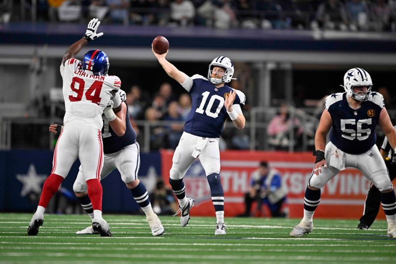 Dallas Cowboys quarterback Cooper Rush (10) throws against the New York Giants during the second half of an NFL football game in Arlington, Texas, Thursday, Nov. 28, 2024. (AP Photo/Jerome Miron)