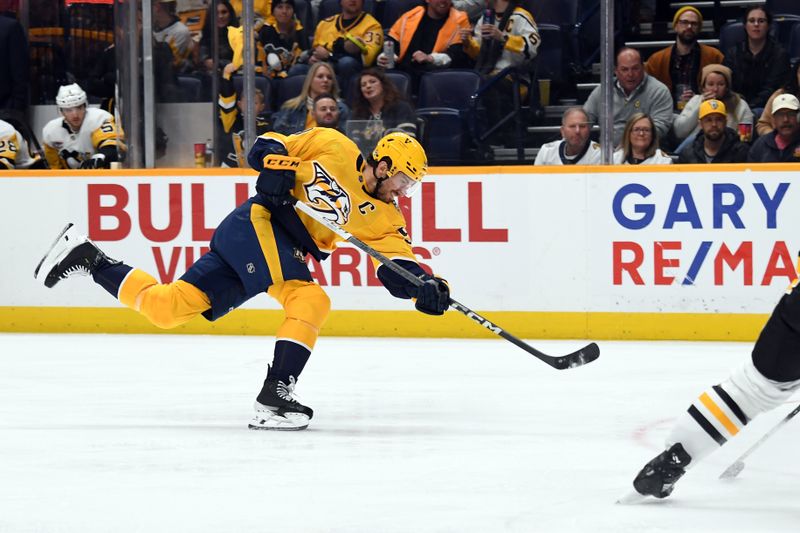 Nov 28, 2023; Nashville, Tennessee, USA; Nashville Predators defenseman Roman Josi (59) attempts a shot during the third period against the Pittsburgh Penguins at Bridgestone Arena. Mandatory Credit: Christopher Hanewinckel-USA TODAY Sports