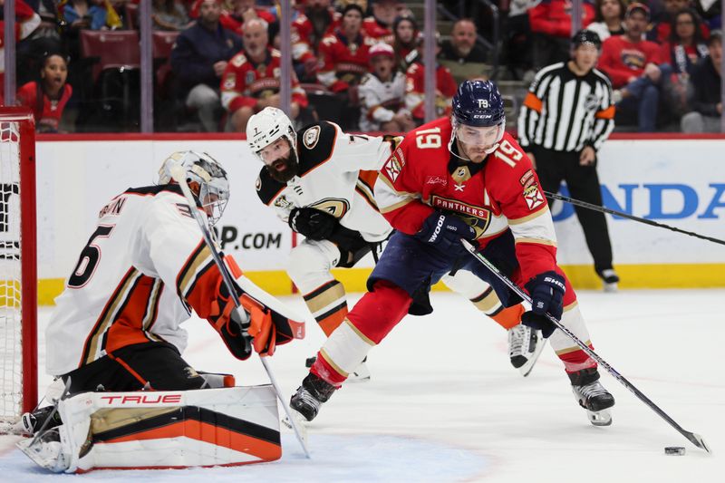 Jan 15, 2024; Sunrise, Florida, USA; Florida Panthers left wing Matthew Tkachuk (19) controls the puck in front of Anaheim Ducks goaltender John Gibson (36) during the second period at Amerant Bank Arena. Mandatory Credit: Sam Navarro-USA TODAY Sports