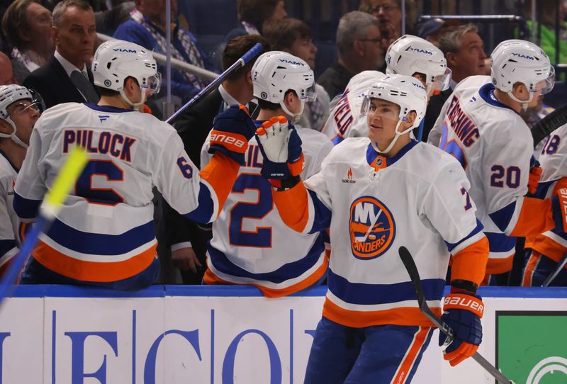 Nov 1, 2024; Buffalo, New York, USA;  New York Islanders right wing Maxim Tsyplakov (7) celebrates his goal with teammates during the second period against the Buffalo Sabres at KeyBank Center. Mandatory Credit: Timothy T. Ludwig-Imagn Images