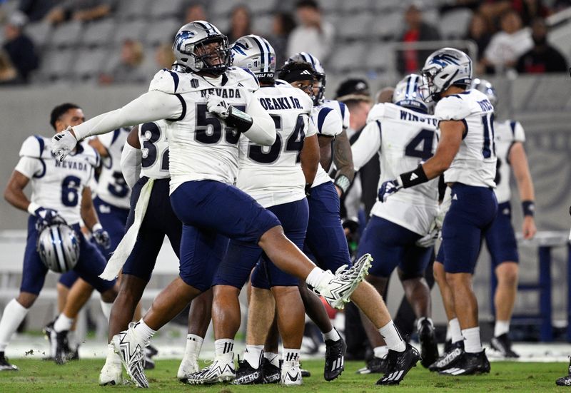 Oct 21, 2023; San Diego, California, USA; Nevada Wolf Pack defensive lineman Mackavelli Malotumau (55) celebrates after a turnover by the San Diego State Aztecs during the second half at Snapdragon Stadium. Mandatory Credit: Orlando Ramirez-USA TODAY Sports 