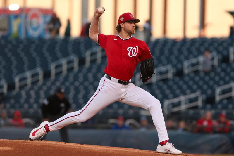 Feb 22, 2026; West Palm Beach, Florida, USA; Washington Nationals starting pitcher Jake Irvin (27) delivers a pitch against the Philadelphia Phillies during the first inning at CACTI Park of the Palm Beaches. Mandatory Credit: Sam Navarro-Imagn Images