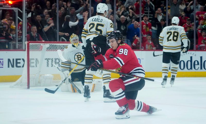 Oct 24, 2023; Chicago, Illinois, USA; Chicago Blackhawks center Connor Bedard (98) celebrates a goal against the Boston Bruins that was taken away because of a offside call during the first period against the Boston Bruins at United Center. Mandatory Credit: David Banks-USA TODAY Sports